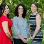 three residents smiling