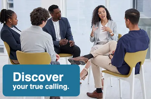 A group of five people sitting in a circle having a discussion in a bright room. One woman is speaking while others listen attentively. A blue box in the image contains the text, Discover your true calling.